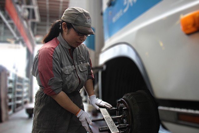 Young female mechanic, veteran truck-lover Ultimate drivers keep the world moving!